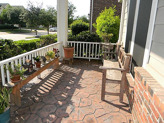 Note the decorative flooring on your front porch. Shaded and relaxed you can chat with your neighbors here.