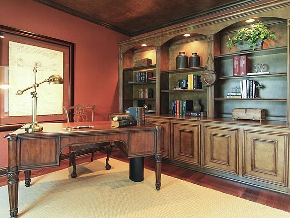 Study features beautiful custom faux painted wood built-ins, hardwood floors and custom ceiling decor and paint.