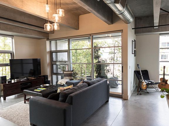 living space from another angle, surrounded by windows from every side.