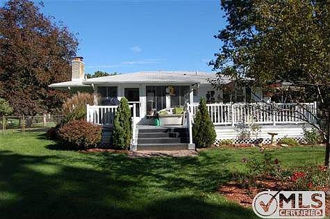 Back view of home showing spacious deck.