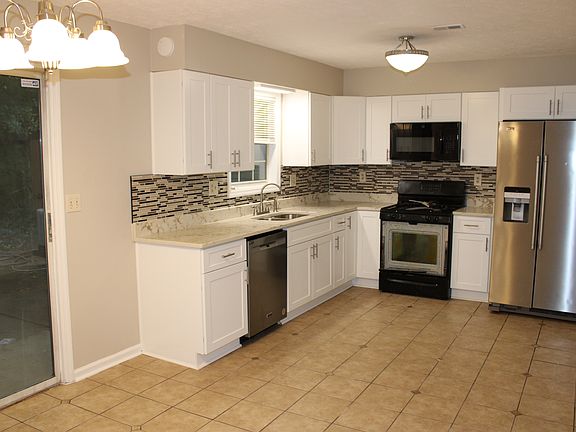 Updated kitchen with new cabinets, backsplash, appliances.