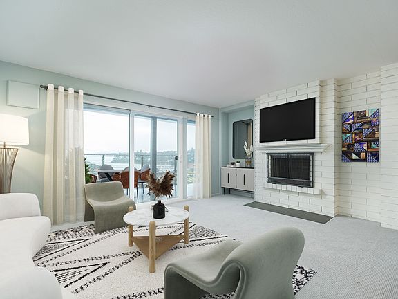 Enter to find a casual, contemporary coastal vibe with serene views throughout this one-level condo. Note: image includes virtual staging.