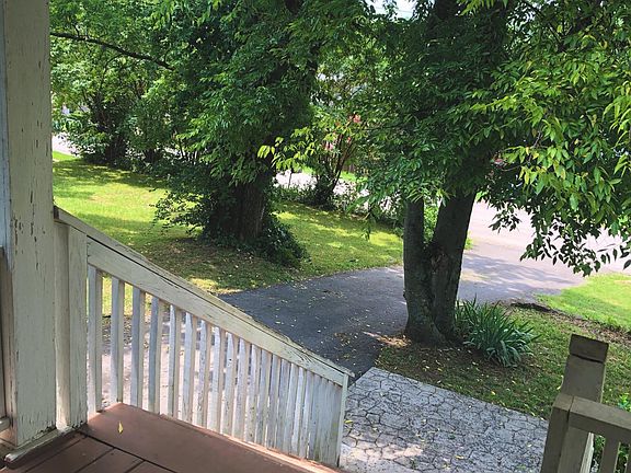 View from covered porch entrance overlooking the paved drive way.