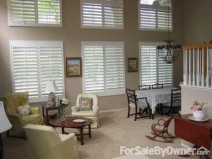 Family Room
						:
						Real wood plantation shutters throughout