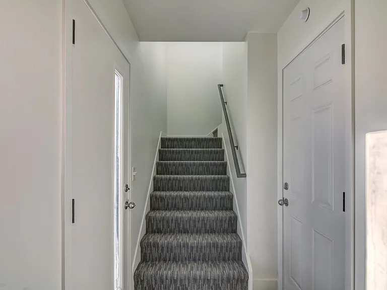 stairway going up from garage to main floor