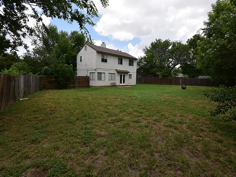 Enjoy a wide-open private fenced lawn.