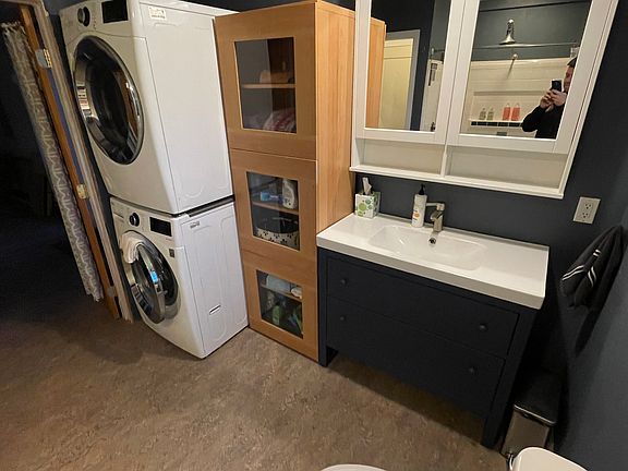 Larger bathroom with laundry, connects to bedroom 1 and 3rd room.