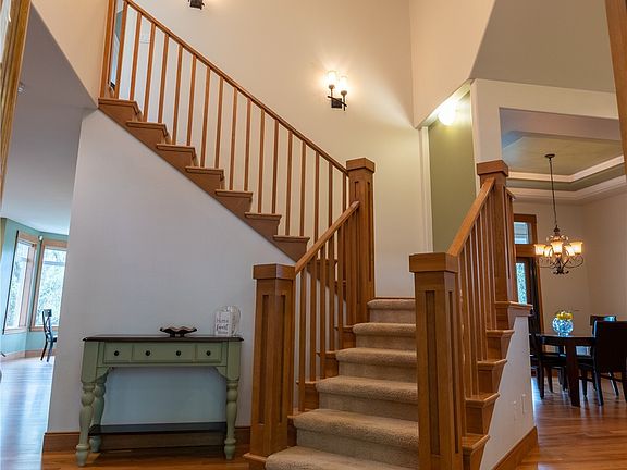 Grand entry with huge ceilings and sparkling refinished wood floors