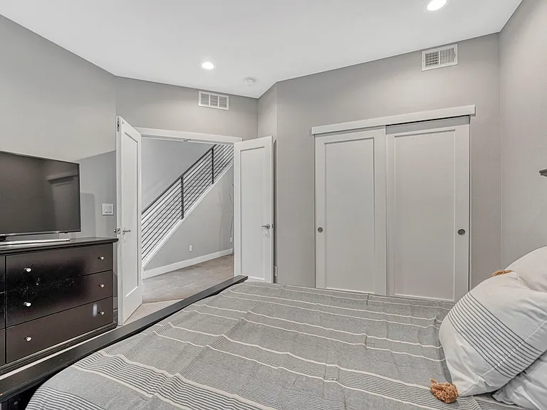 Bedroom with walk-out patio, entry level