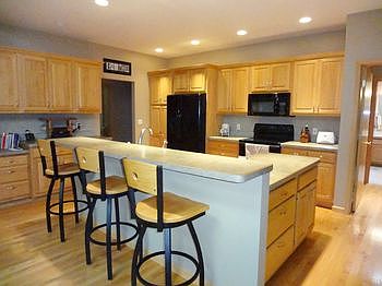 A delightful well equipped kitchen that is open to the br /great room. The doorway in back left corner leads to br /the pantry and laundry rooms.  The kitchen appliances will stay.