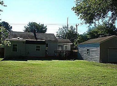 back yard, custom deck and side of detached garage