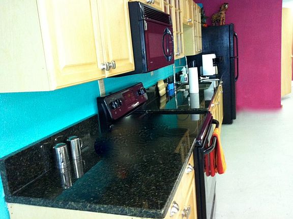 granite countertops; maple cabinets