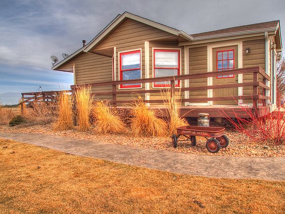 Rear of house with wrap deck