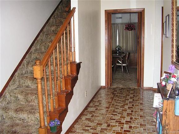 Entry way with tile floor.  2 bedrooms and 1 bath upstairs!