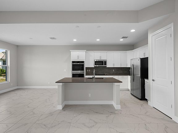 Kitchen Island and Dining 12476 SW Sunrise Lake Terrace