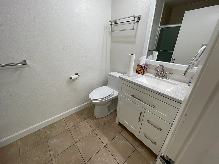second bathroom, which includes a tub and shower.