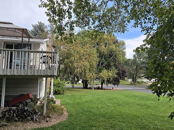 Backyard facing side of house and street