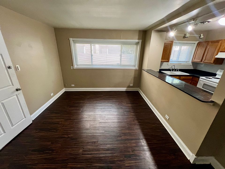 View from the middle of the living room area facing north and building front door