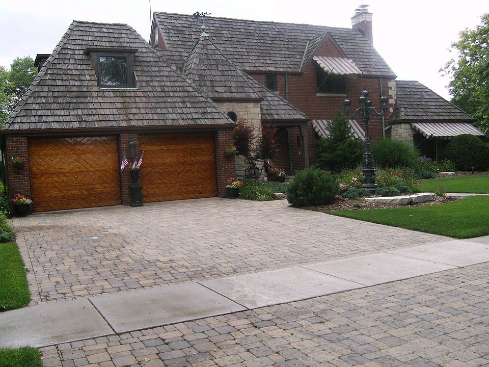 Cedar Shake, all brick and stone beauty! Garage doors are amazing!