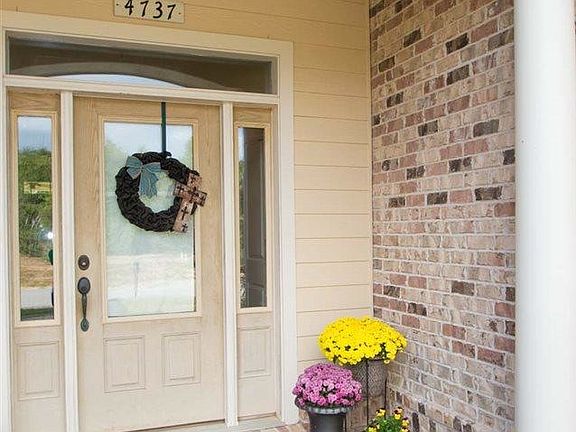 Welcoming front entrance with slate floors and large front c