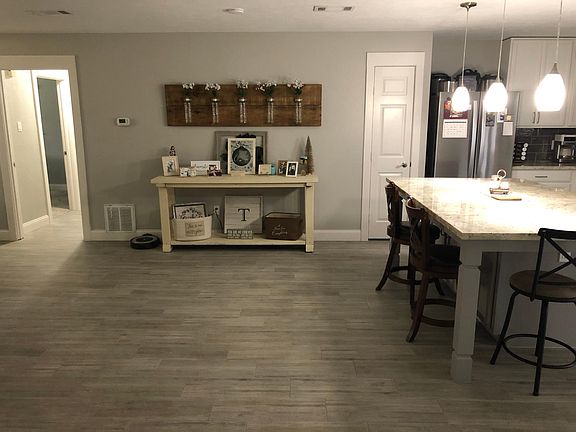 Large space for dining room table in addition to huge island with space for 3+ chairs