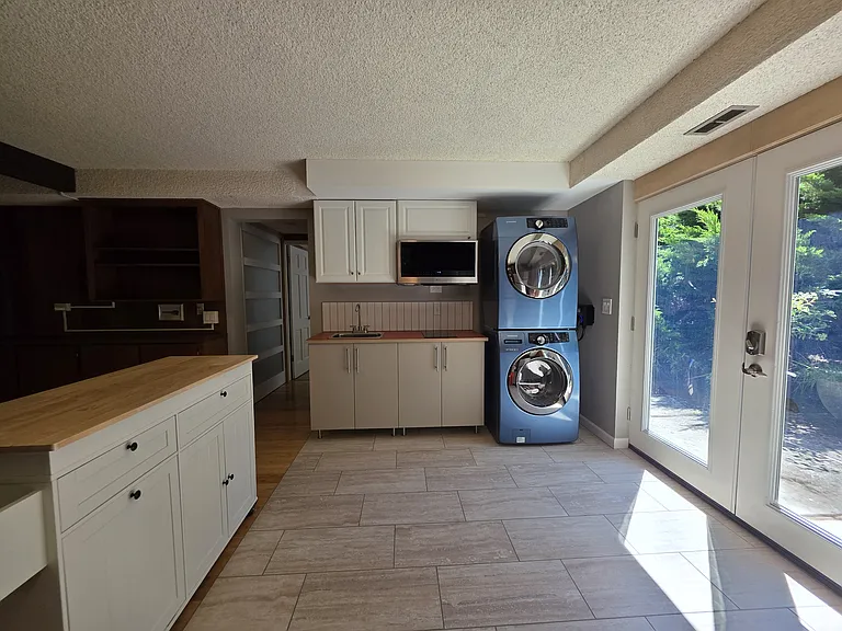 Bright kitchen with laundry in-unit.
