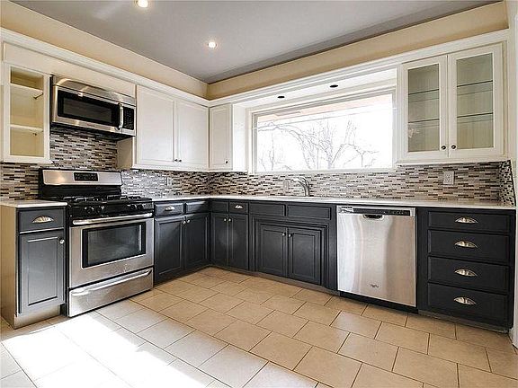 Updated kitchen with stainless steel appliances.
