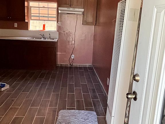 Front entrance view of kitchen/ living room space