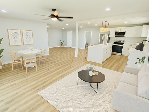 Large open concept living/dining room and kitchen. 

This photo has been digitally staged using AI. Dimensions/perspective may differ slightly from actual.