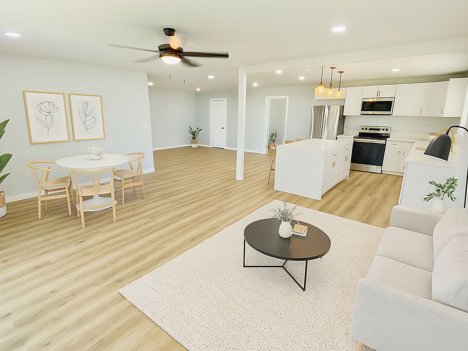Large open concept living/dining room and kitchen. 

This photo has been digitally staged using AI. Dimensions/perspective may differ slightly from actual.
