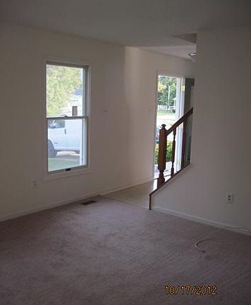 LIVING ROOM AND FOYER