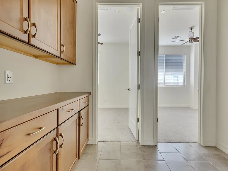 Loft area has upgraded cabinetry with lots of storage space.