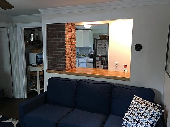 Half wall with counter connects kitchen with living area