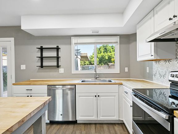 Kitchen with Dish Washer, Stove, and Refrigerator - View 2