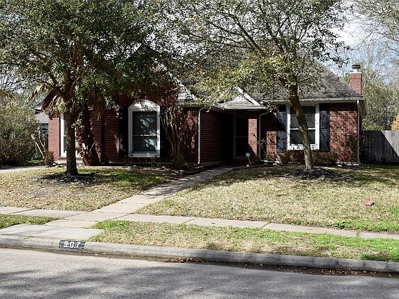 One Story, all brick, guttering, sprinkler system