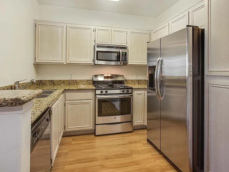 Select kitchens offer GE stainless steel appliances and granite countertops
