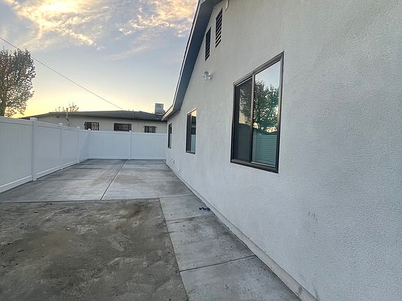 gated, secured and private side yard, space for 2 cars