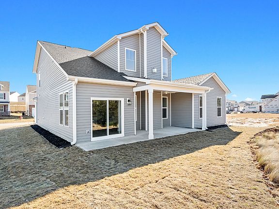 2 story, single family home with a covered front porch and spacious owner s suite