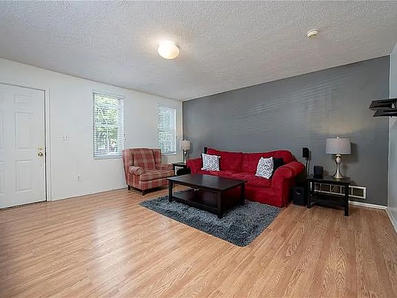 entry living room area when it was furnished and prior to painting