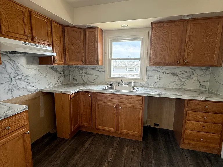 Kitchen. Appliances (Range, Dishwasher, and Refrigerator) are provided and will be delivered the week of June 15th.