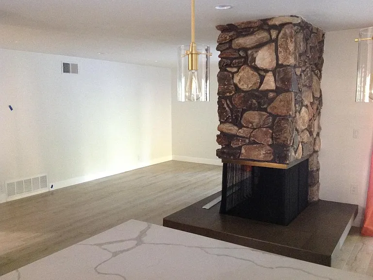 Rock Fireplace in Kitchen, Great Room and Dining Area
