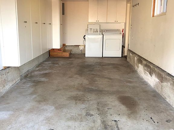 garage with extra storage above. Washer/Dryer