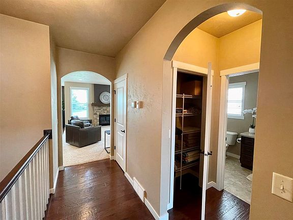 Foyer closet and view to main bath