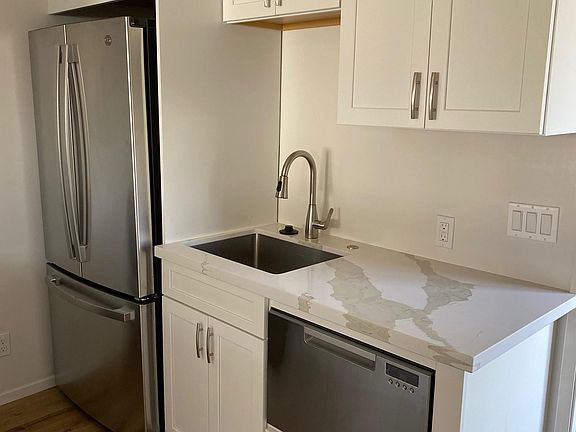 Kitchen with dishwasher and new refrigerator/ice maker