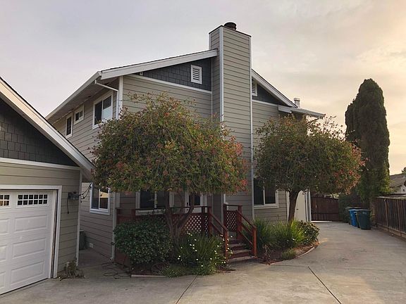 Rear entrance to the kitchen, garage and enough driveway to turn your car around.
