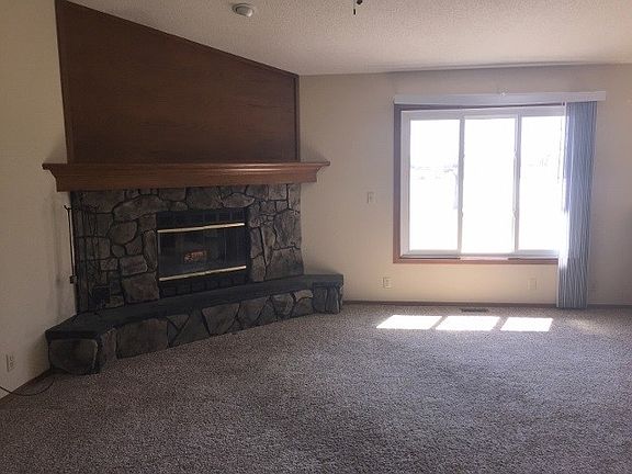 Living Room with wood burning fireplace.