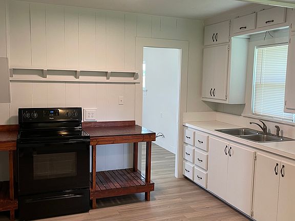 Kitchen with prep counter, new LED lighting and vinyl flooring