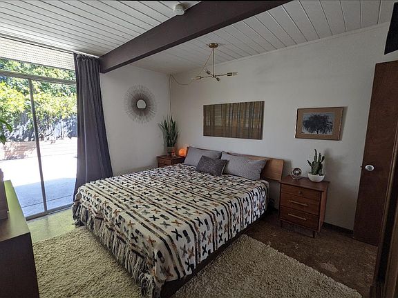 Main bedroom with sliding door to backyard