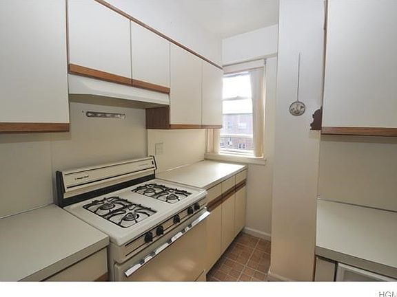 Updated kitchen has plenty of cabinets and counter space.  Appliances include a dishwasher, range and refrigerator.
