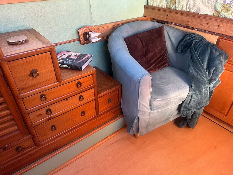 The comfy chair is a great place to cozy up with a blanket and a book!